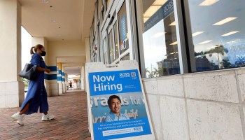 A Now Hiring near the entrance to a Ross department store on September 21, 2021 in Hallandale, Florida.