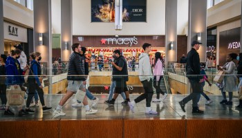 Holiday shoppers walk through a mall in Houston, Texas.