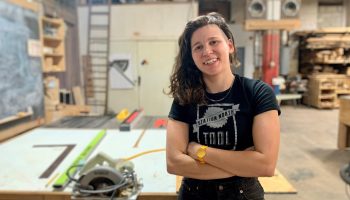 Jessa Wais, co-director of the Station North Tool Library in Baltimore, poses in a workshop space.