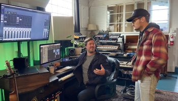 Ruby Room Recordings’ producer, engineer and songwriter Elan Wright, left, listens to the mix of a new song with with musician Mark Diamond.