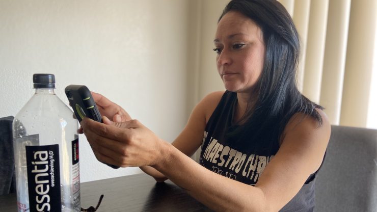 Tiffany Hopkins searches for new rental listings after hearing she had to be out of her triplex in Yucca Valley before Christmas. Hopkins has heard the property will be converted to short-term rentals.