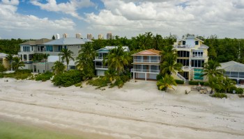 An aerial photo shows beachfront vacation homes in Barefoot Beach, Florida.