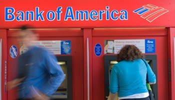 People use a Bank of America automatic teller machine (ATM) in Washington on September 15, 2008.