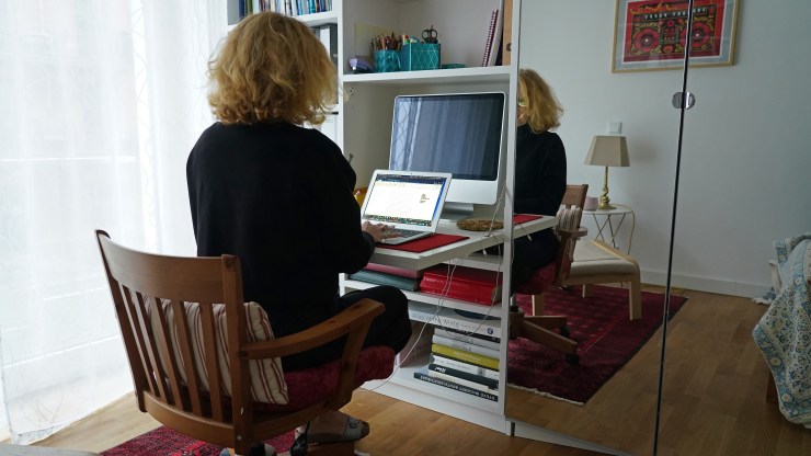A woman, who normally works in the office of a foundation, works at her laptop from home during a four-week semi-lockdown during the second wave of the coronavirus pandemic in Berlin in 2020.