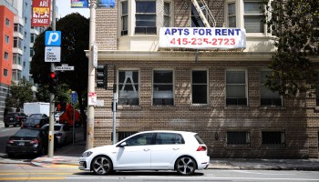 A "for rent" sign posted on an apartment building in San Francisco.