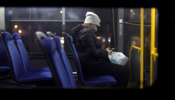 A woman wears a mask on a Metro Bus December 21, 2021 in Washington, DC.