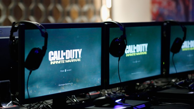 Monitors reading "Call of Duty" are set up at a fan experience event.