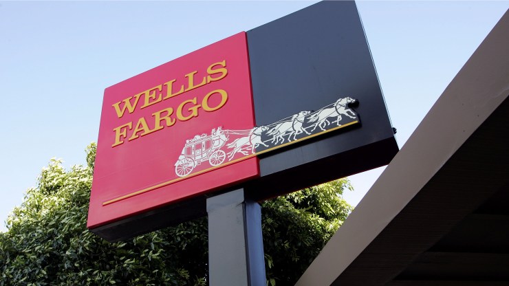 The Wells Fargo logo is seen on a sign outside of a Wells Fargo Home Mortgage branch office March 20, 2007 in San Francisco, California..
