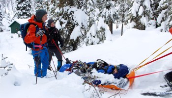 Idaho Mountain Search and Rescue Unit volunteers extract a person portraying a lost snowshoeing enthusiast during a training exercise.