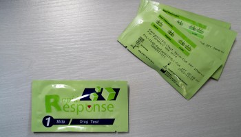 Packages of fentanyl test strips and instructions for use.