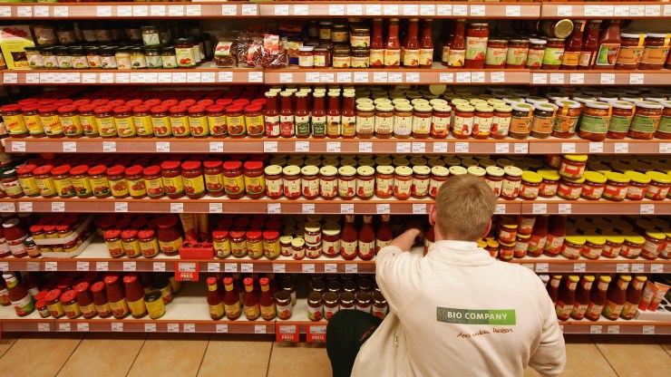 An employee stocks shelves at a branch of German organic grocery store chain Bio Company in Berlin in 2011.