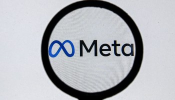 This photograph taken on October 28, 2021 shows the META logo on a laptop screen.
