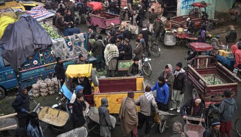 People shop at a vegetable market in Kabul.