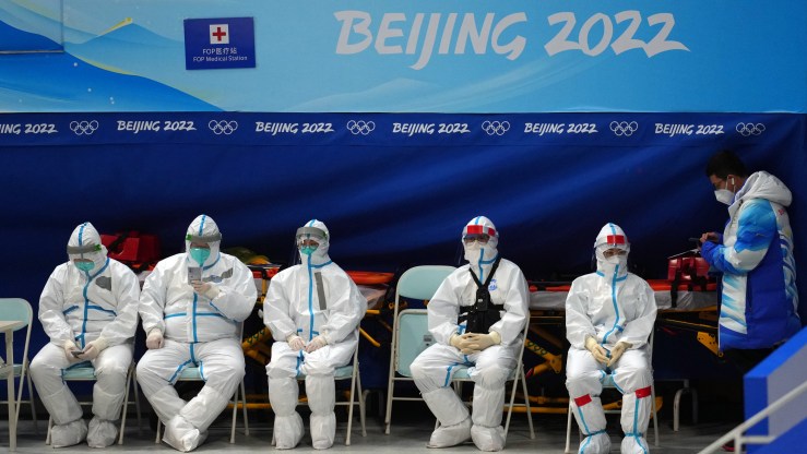 Medical staff wearing personal protective clothing work at the National Indoor Stadium on February 3, 2022 in Beijing, China