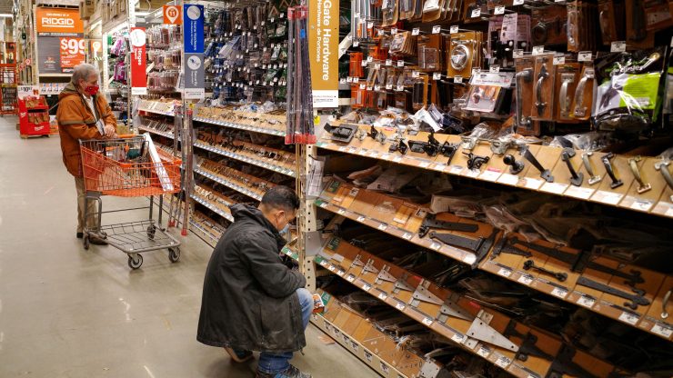 Shoppers look at products at a Home Depot store.