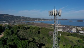 In an aerial view, a cellular tower stands on the top of a hill on January 18, 2022 in Larkspur, California.