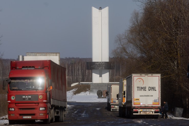 Trucks wait to cross through customs at the Ukrainian border.