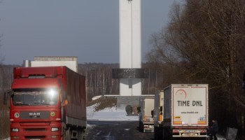 Trucks wait to cross through customs at the Ukrainian border.