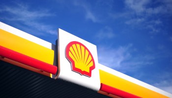 The Shell logo is pictured in front of a clear sky outside a Shell petrol station in central London on January 17, 2014.