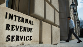 A man walks into the federal, IRS building in Washington, D.C.