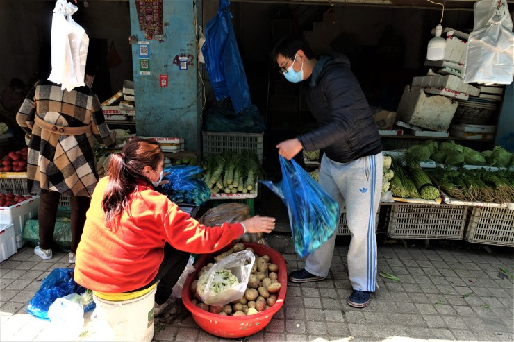 Vegetable stands in a suburb of Shanghai still a few days from lockdown on the west side of the city