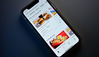 A phone with a food delivery app open