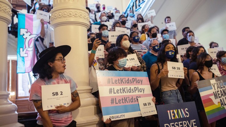 LGBTQ rights supporters gather at the Texas State Capitol to protest state Republican-led efforts to pass legislation that would restrict the participation of transgender student athletes on the first day of the 87th Legislature's third special session on September 20, 2021 in Austin, Texas.