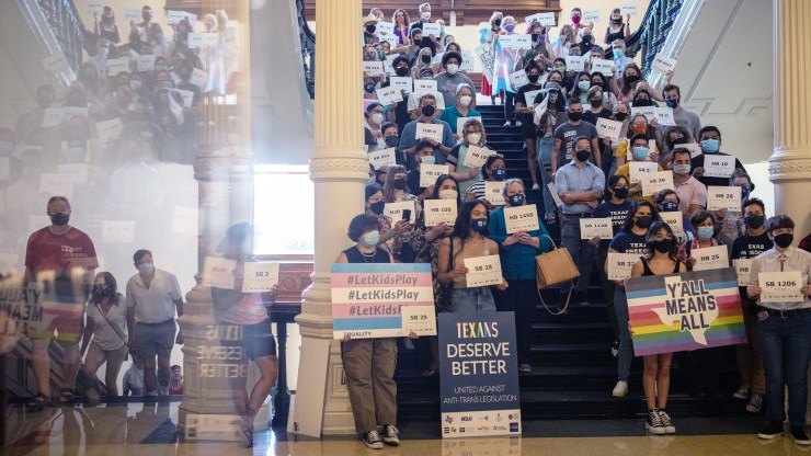 LGBTQ rights supporters gather at the Texas State Capitol to protest state Republican-led efforts to pass legislation that would restrict the participation of transgender student athletes on the first day of the 87th Legislature's third special session on September 20, 2021 in Austin, Texas.