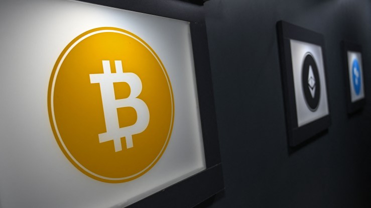 A bitcoin symbol is pictured at a cryptocurrency exchange branch near the Grand Bazaar in Istanbul.