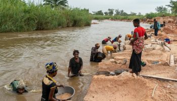 DR Congo artisanal miners collecting gravel from the river
