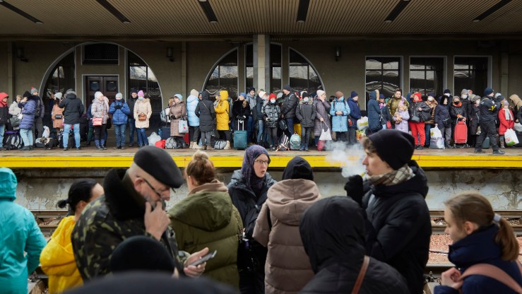 People wait to board an evacuation train in Kyiv, Ukraine.