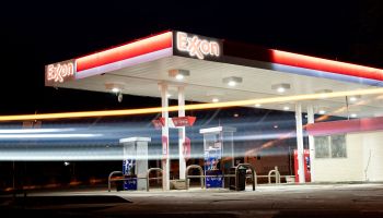 A vehicle drives past an Exxon gas station in Washington, DC.