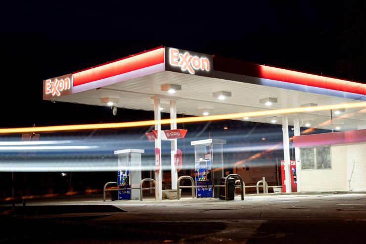 A vehicle drives past an Exxon gas station in Washington, DC.