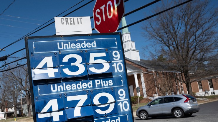 A gas station sign shows costs of $4.35 and $4.79 a gallon.