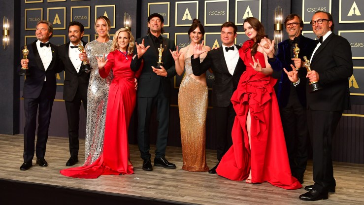 The cast and producers of CODA hold their award for best picture during the Academy Awards in Hollywood.
