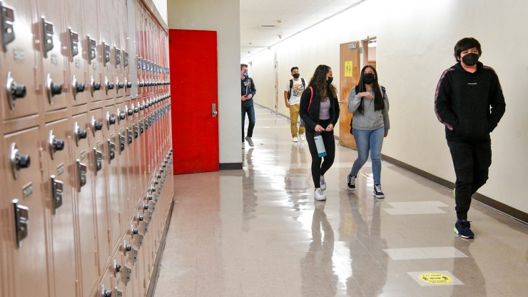 Students walk in the hallway at Hollywood High School in Los Angeles.