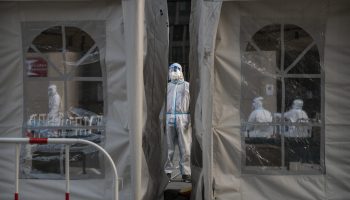 A person in a protective suit at a coronavirus testing site in China.