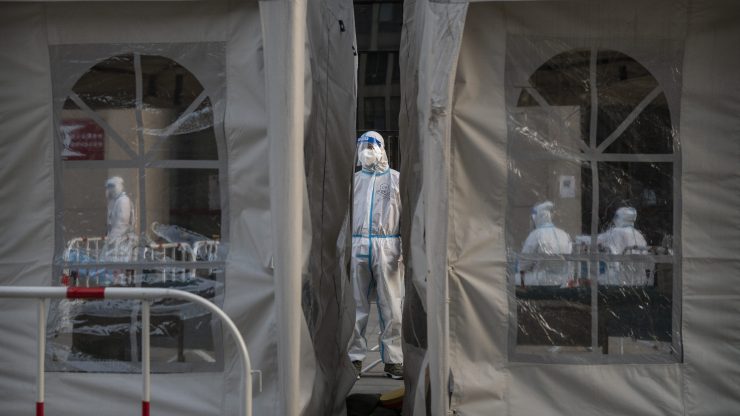A person in a protective suit at a coronavirus testing site in China.