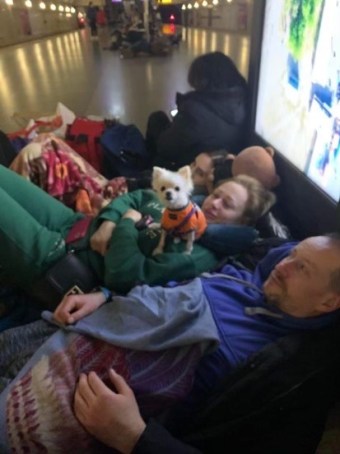 A family sleeps in a Kyiv subway station during Russian bombing.