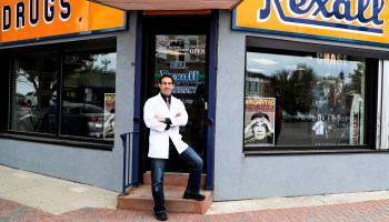 Tony Minniti, owner of Bell Pharmacy, outside his store.