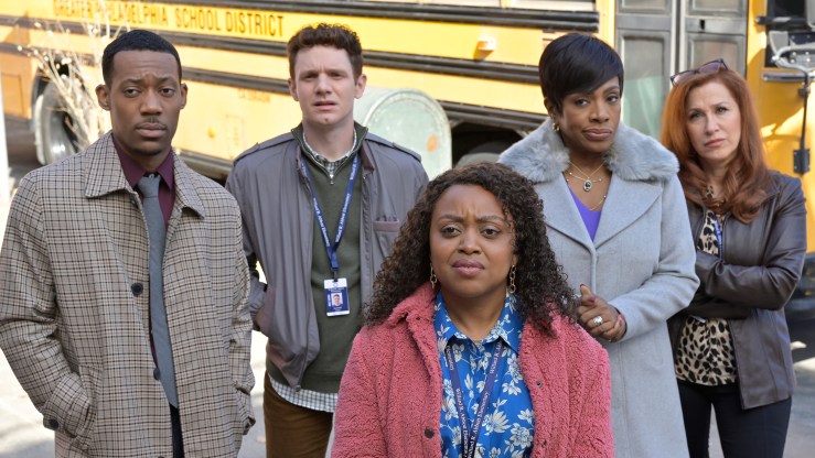From left to right, Tyler James Williams, Chris Perfetti, Quinta Brunson, Sheryl Lee Ralph and Lisa Ann Walter are seen standing in front of a school bus.