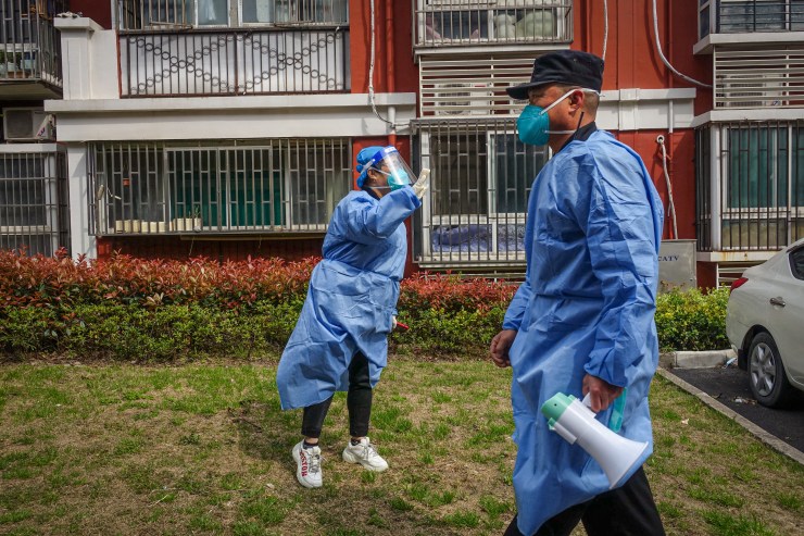 Community workers in Shanghai keep residents informed through megaphones during the lockdown. (Charles Zhang/Marketplace)