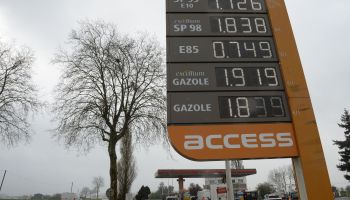 A large sign lists gas prices in France.