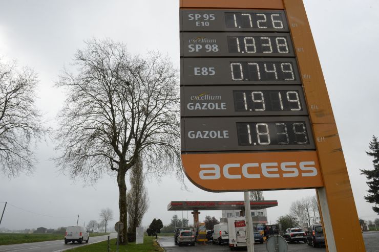 A large sign lists gas prices in France.