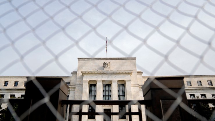 The Marriner S. Eccles Federal Reserve building is seen through fencing in Washington, DC, on April 13, 2022.
