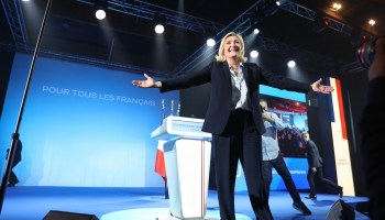 French far-right party Rassemblement National (RN) presidential candidate Marine Le Pen arrives on stage during an election campaign meeting in Arras, northern France, on April 21, 2022, ahead of the second round of France's presidential election