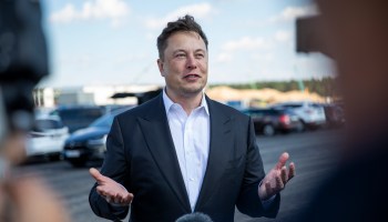 Portrait image of Elon Musk outdoors.