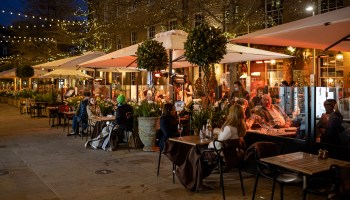Diners eating outdoors at a London restaurant in April 2021.