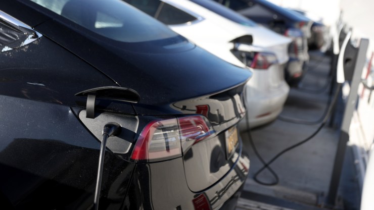 Tesla cars recharge their batteries at the Geary Boulevard Supercharger on March 09, 2022 in San Francisco, California.