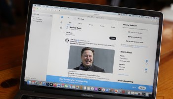 Elon Musk trending on Twitter is shown on a laptop screen.
